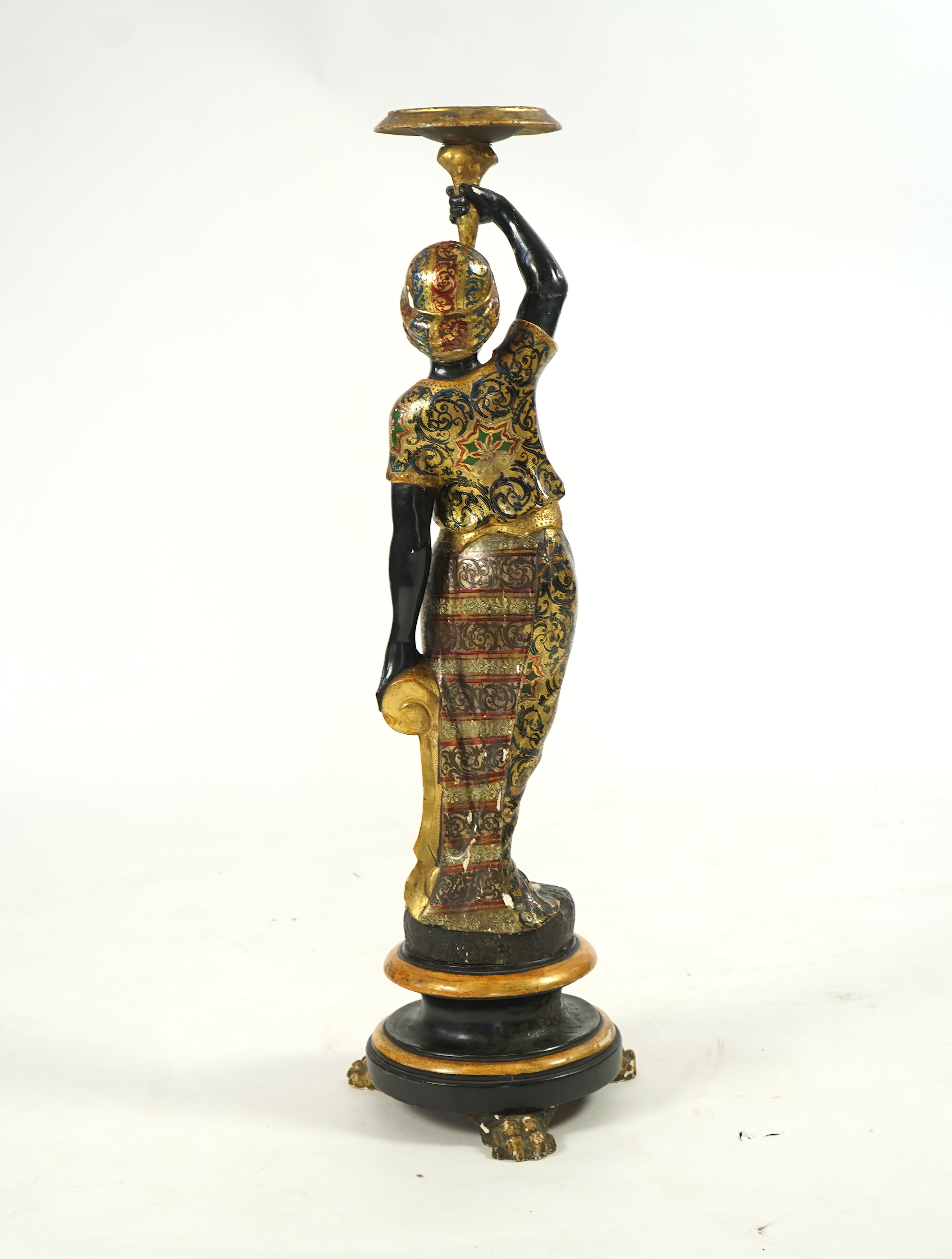 A 19th century Italian carved wood and composition polychrome painted blackamoor torchere